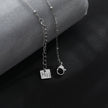 Collier RIHANNA à chaîne perlée avec pendentif serpent en zircone pavée, en argent.
