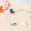 Sterling Silver Seashell Charm Bracelet with Blue CZ Gradient