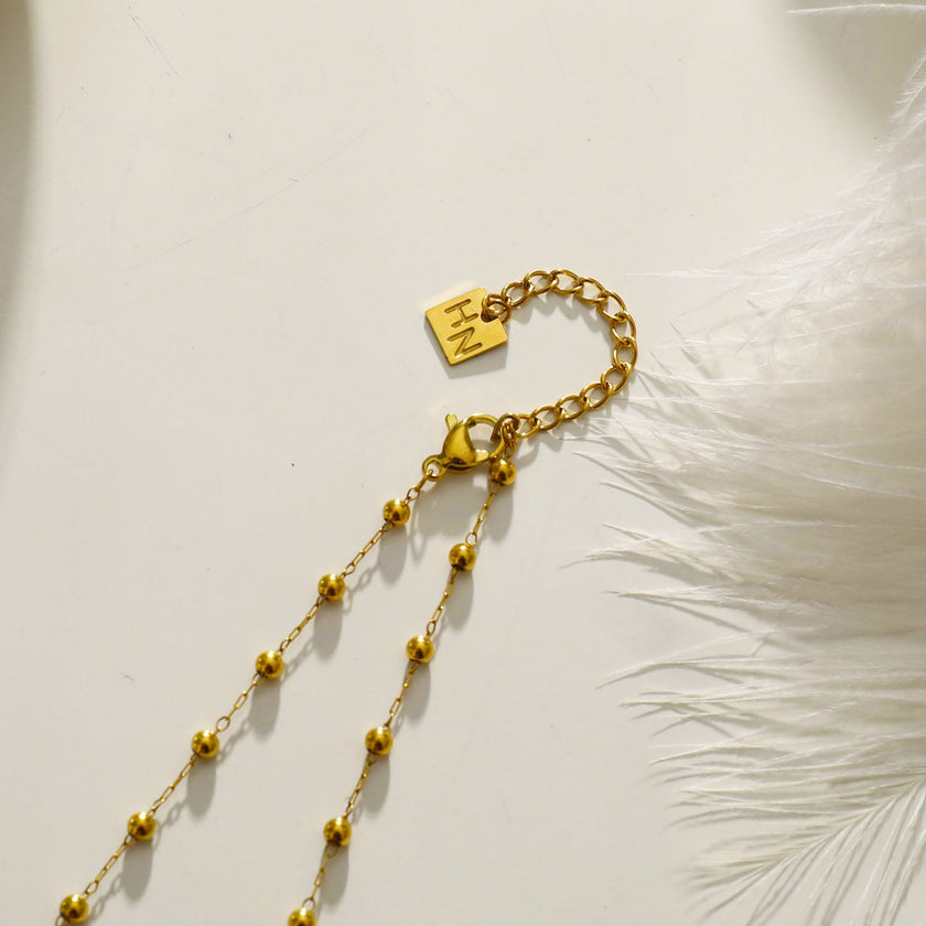 SANTA CRUZ Black: Gold & Black Onyx Beaded Chain Necklace