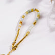 SUMAN : Bracelet en pierres d'aventurine rose et perles dorées.