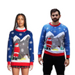 Couple - Pull de Noël représentant le Père Noël faisant pipi sur un bonhomme de neige qui fond.