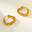 Style TENDER Or : Mini boucles d'oreilles en forme de cœur serties de zircons pavés.