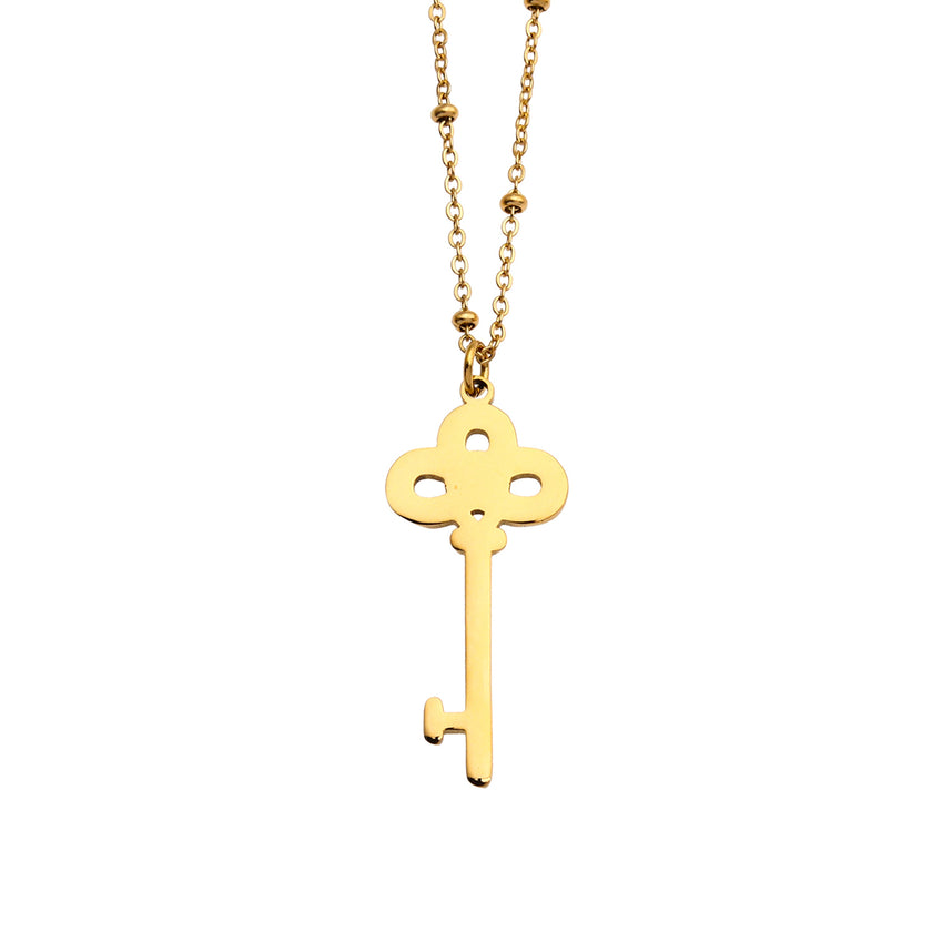Collier UNLOK en or perlé avec pendentif clé orné de zircons.