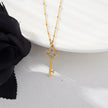 Collier UNLOK en or perlé avec pendentif clé orné de zircons.