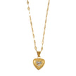 ZITA Gold : Collier délicat à chaîne de style Gucci avec pendentif en forme de cœur pavé de petits diamants scintillants.