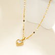 ZITA Gold : Collier délicat à chaîne de style Gucci avec pendentif en forme de cœur pavé de petits diamants scintillants.