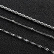 Collier ZURI à trois rangs de chaînes mixtes en argent.