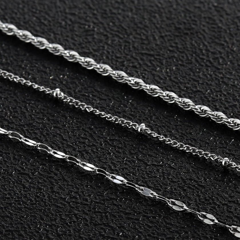 Collier ZURI à trois rangs de chaînes mixtes en argent.