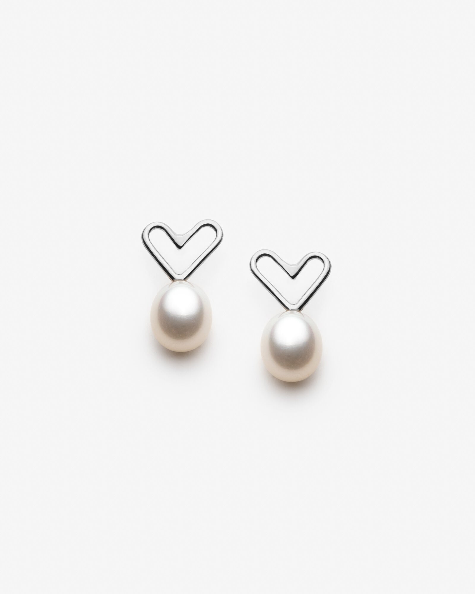 Boucles d'oreilles coeurs avec grosses perles blanches