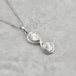 Collier Infini Poire en or 10K et moissanites