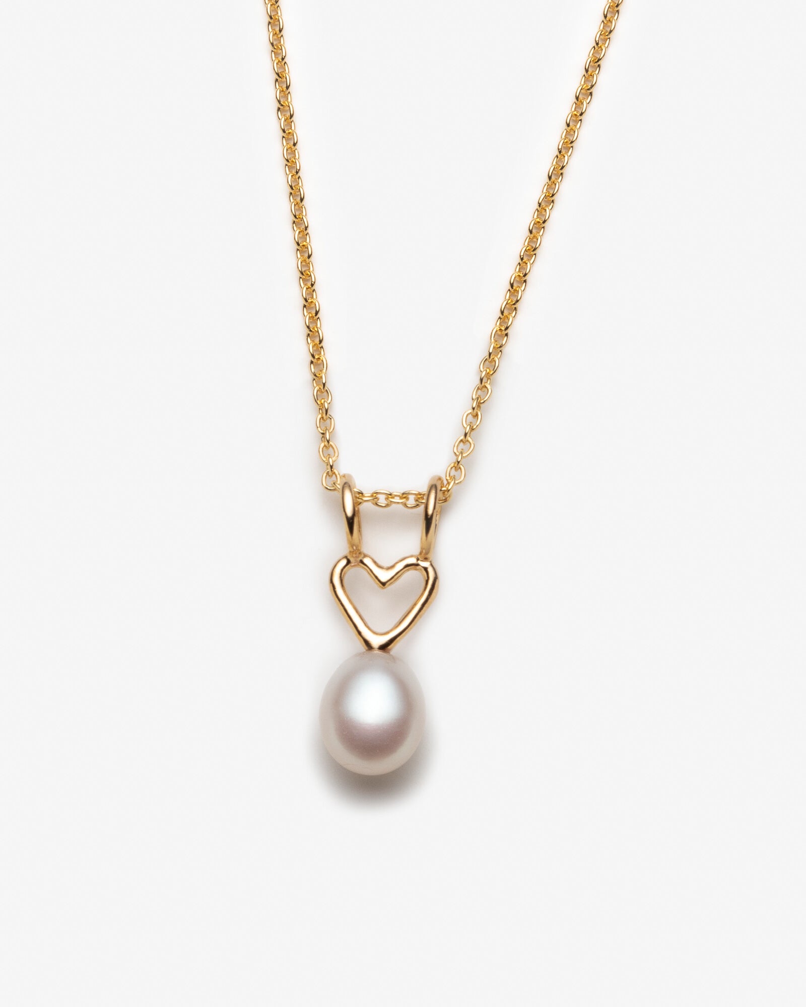 Collier avec breloque coeur et grosse perle blanche