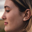 Small round silver or gold studs
