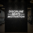 DISCIPLINE BEATS MOTIVATION Neon Sign