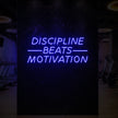 DISCIPLINE BEATS MOTIVATION Neon Sign