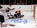 BOBBY HULL SCORES ON JOHNNY BOWER AUTOGRAPHED 8