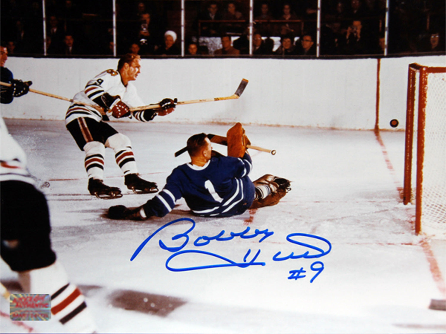 BOBBY HULL SCORES ON JOHNNY BOWER AUTOGRAPHED 8