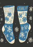 Impression sur toile de chaussettes vintage en tricot bleu sur fond noir.
