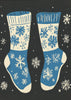 Impression sur toile de chaussettes vintage en tricot bleu sur fond noir.
