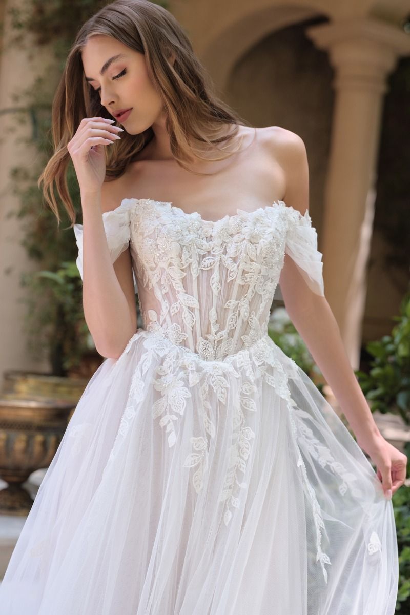 Off-the-shoulder illusion neckline with floral appliqué